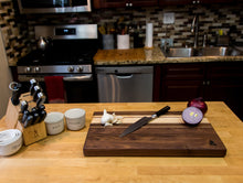 Load image into Gallery viewer, Walnut with stripes of Maple, and Purple Heart Cutting Board