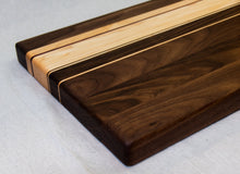 Load image into Gallery viewer, Walnut with stripes of Maple, and Purple Heart Cutting Board
